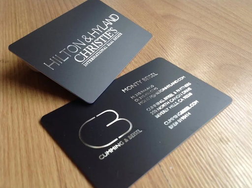 sample modern luxury business cards with silver engravement from hilton and hyland christies